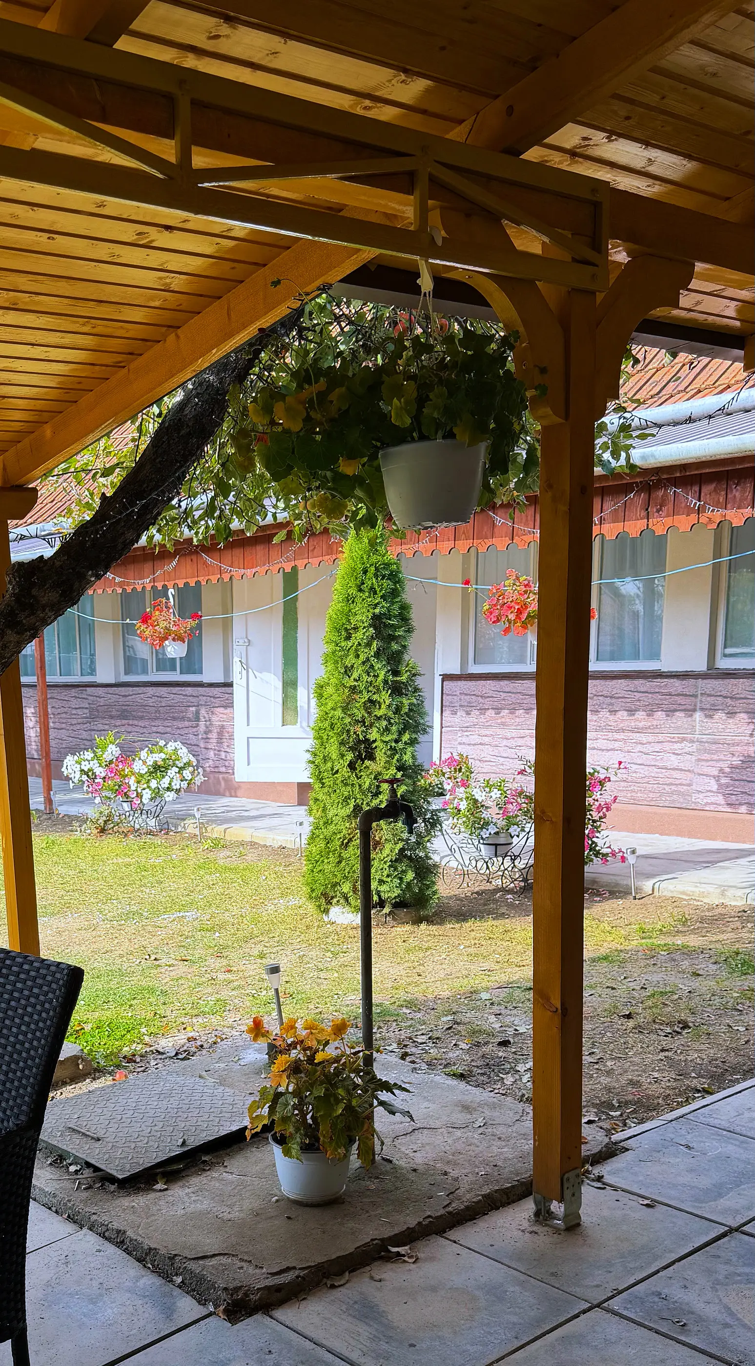 View from under the pergola towards the garden and the house